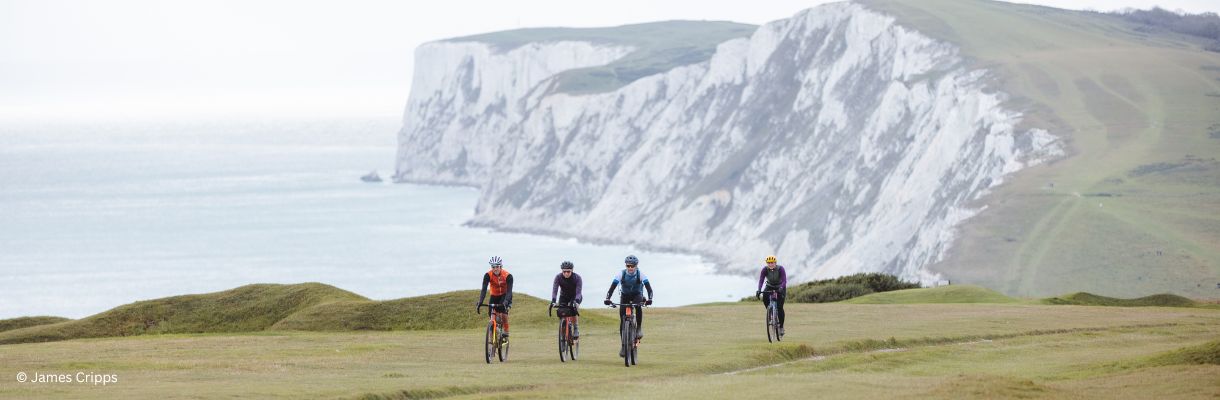 Cyclists riding along the Isle of Wight coastline